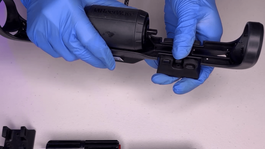 Remove the magnets from the bracket.